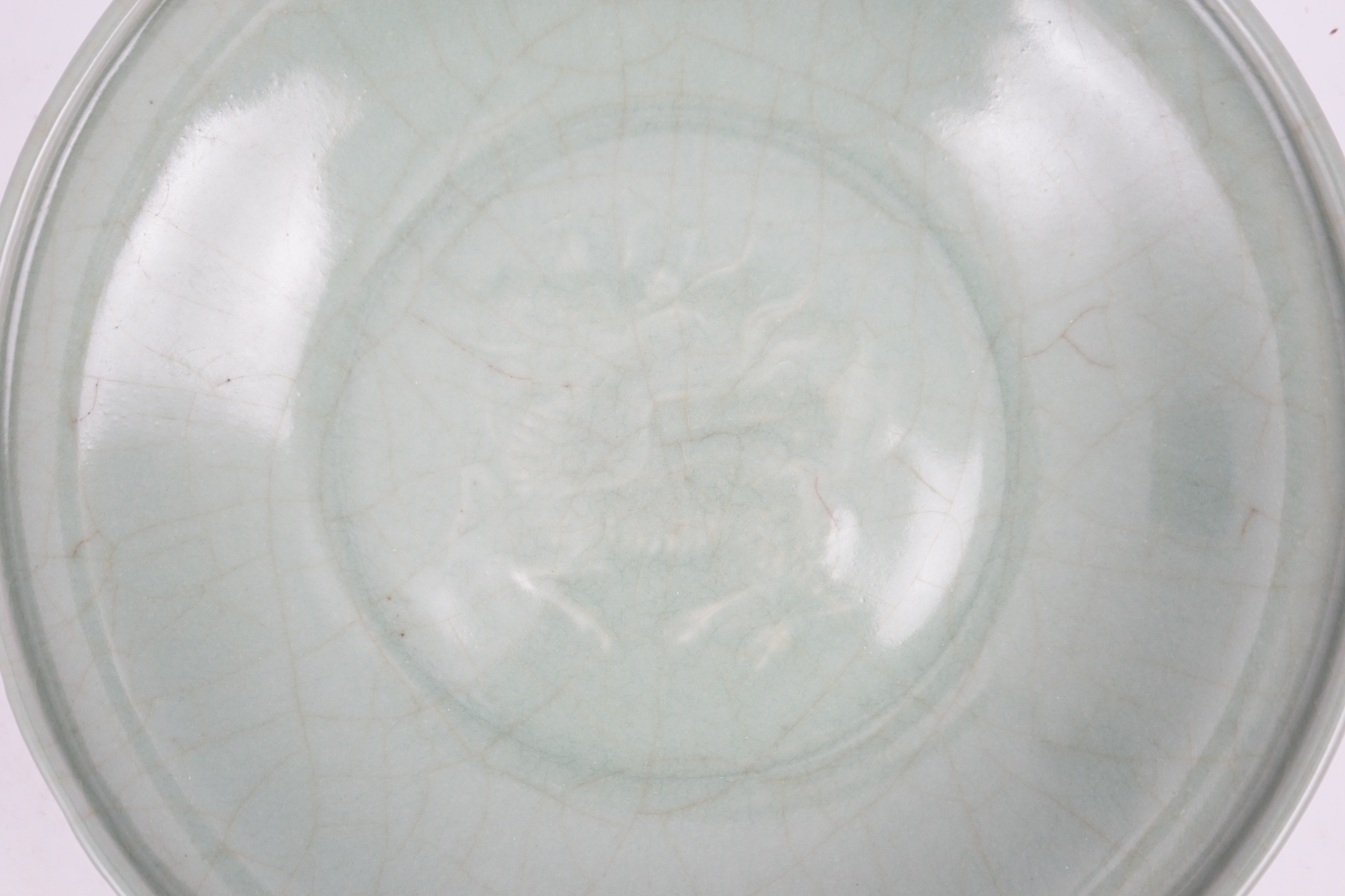 A Chinese Longquan celadon 'qilin' dish, 15th/16th century